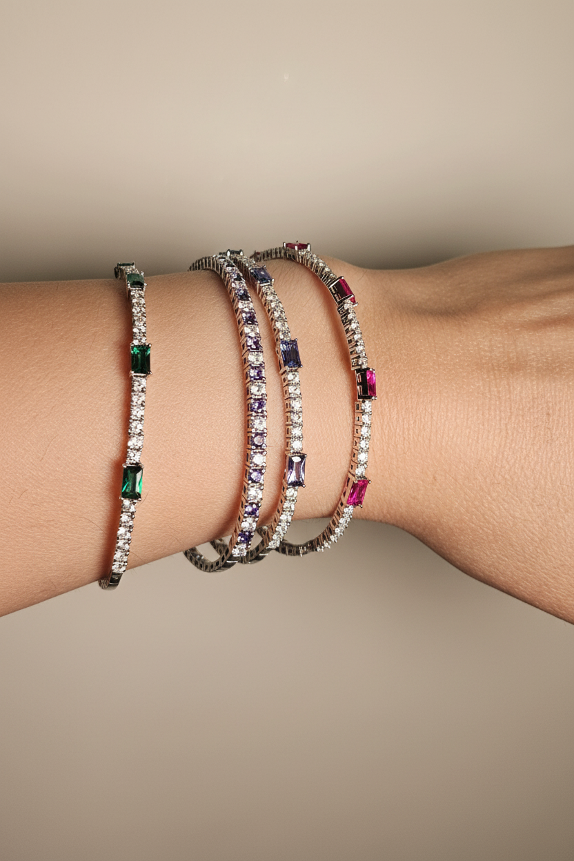Stacked flexi bangles on off-white background